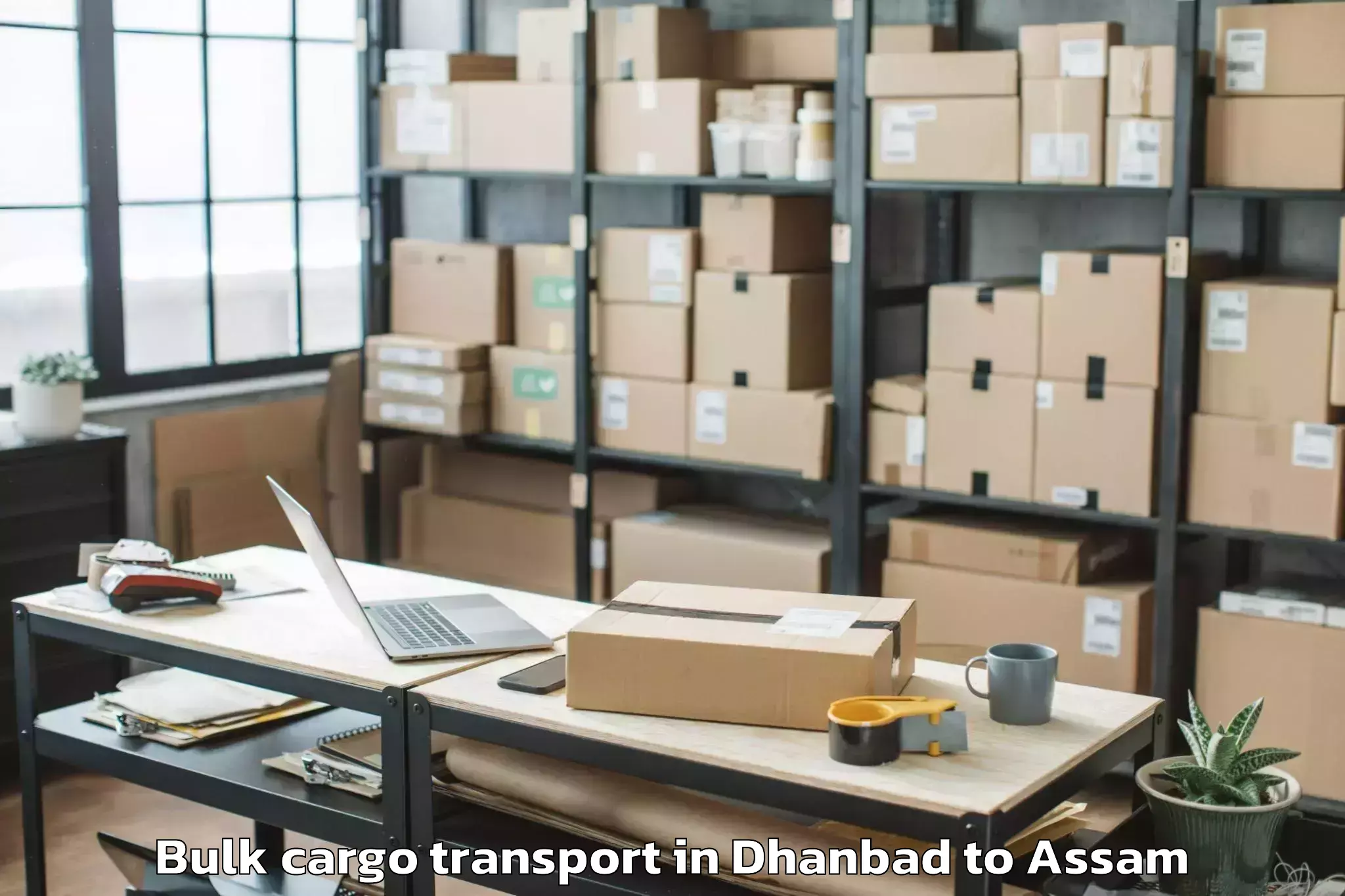 Book Dhanbad to Chariduar Bulk Cargo Transport Online